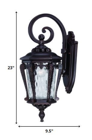 Architectural bronze hanging outdoor wall light with hammered glass shade shown with dimensions of 23 inches high by 9 point 5 inches wide