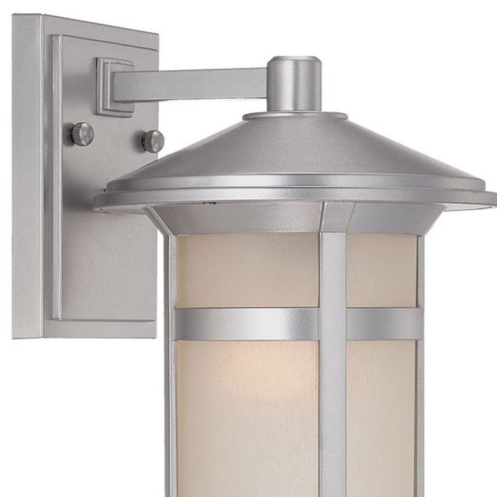 Zoomed in view of the wall plate, arm and partial fixture of the lighted Brushed silver outdoor wall light with white Shoji-inspired glass panels