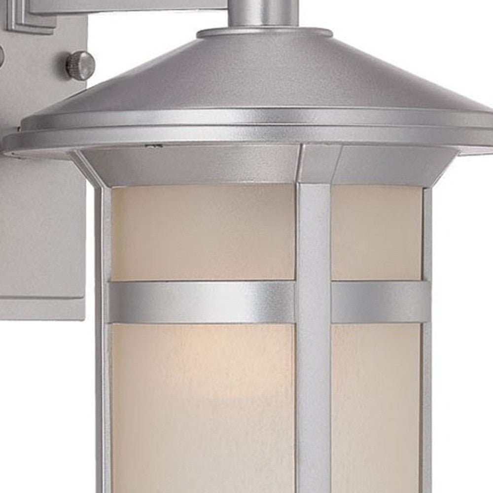 Zoomed in view of the fixture top anfdglass shade of the lighted Brushed silver outdoor wall light with white Shoji-inspired glass panels