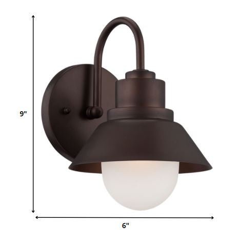 Bronze outdoor wall light with lamp shade design and frosted glass globe – durable weather-resistant exterior wall lighting fixture shown with dimensions of 9 inches high by 6 inches wide