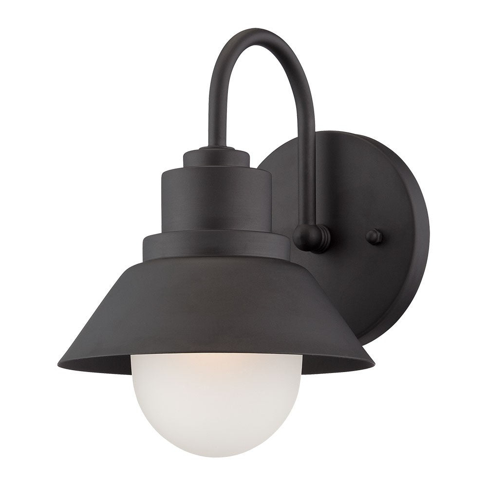 Right side angled view of the lighted Matte black outdoor wall light with lamp shade design and frosted glass globe – modern weather-resistant steel exterior wall lighting fixture.