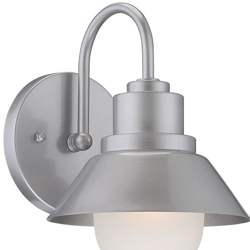 Left side zoomed in angled view of the lighted Brushed silver outdoor wall light with lamp shade design and frosted glass globe – modern weather-resistant steel exterior wall lighting fixture.