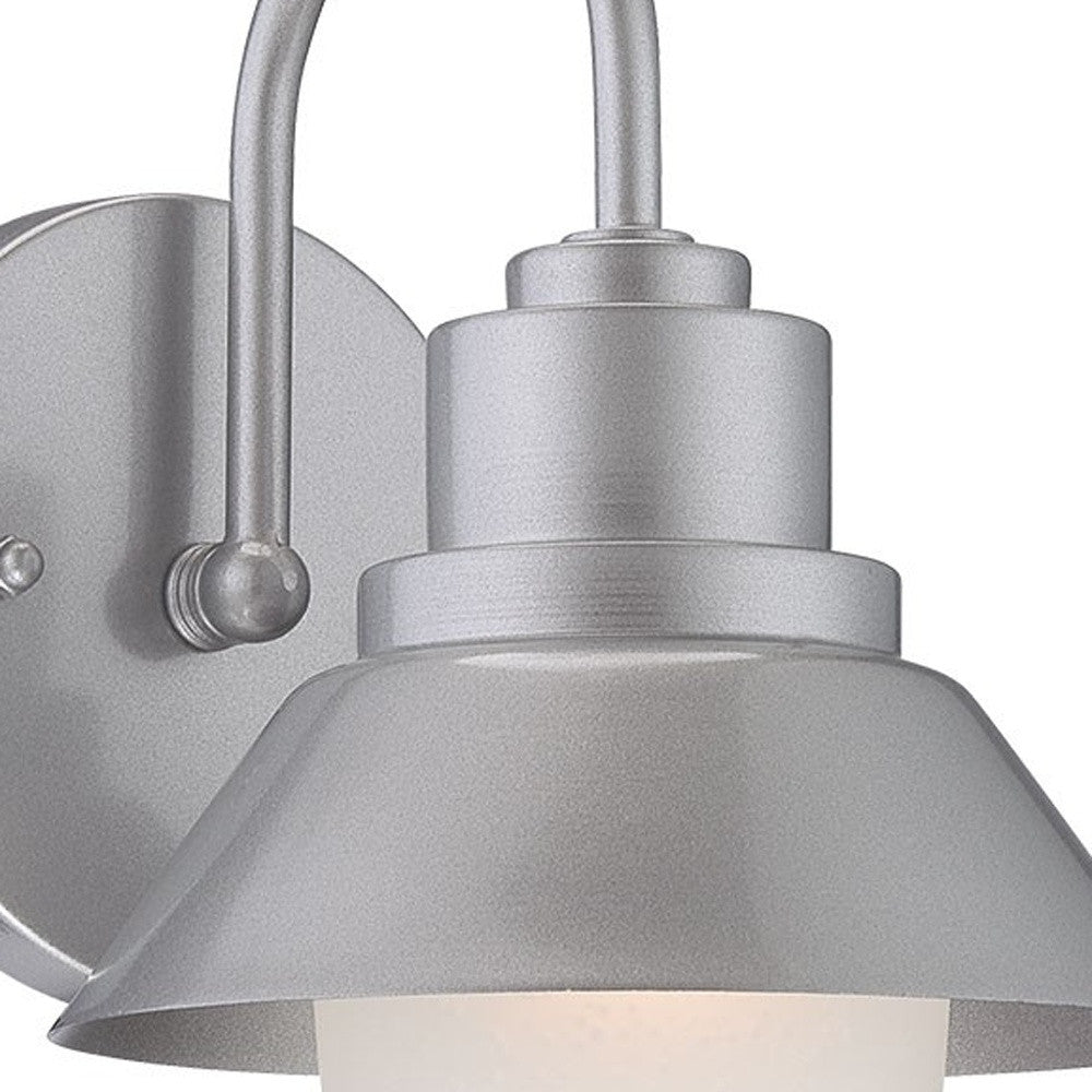 Zoomed in view of the wall plate, arm and fixture of the lighted Brushed silver outdoor wall light with lamp shade design and frosted glass globe – modern weather-resistant steel exterior wall lighting fixture.