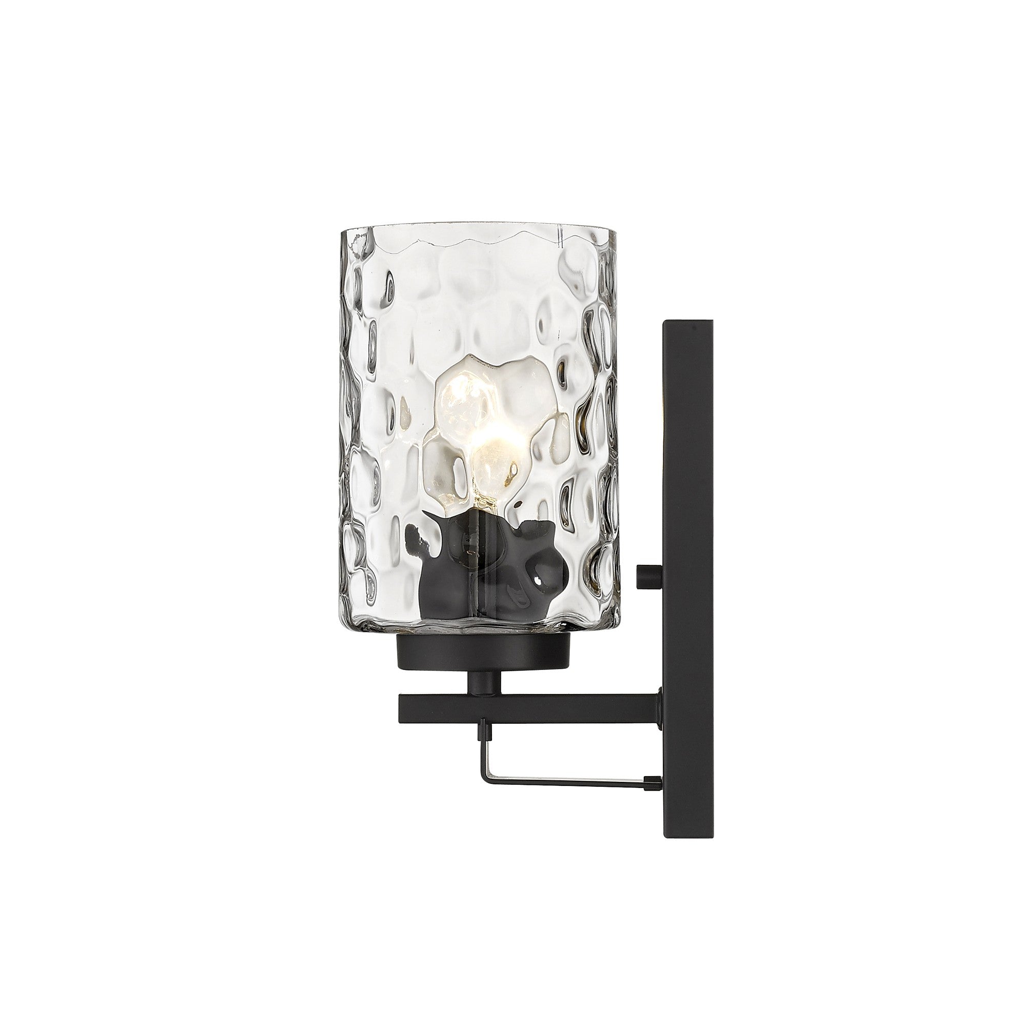 Side view of the lighted Black metal wall sconce with pebbled glass shade – modern indoor single-light fixture.