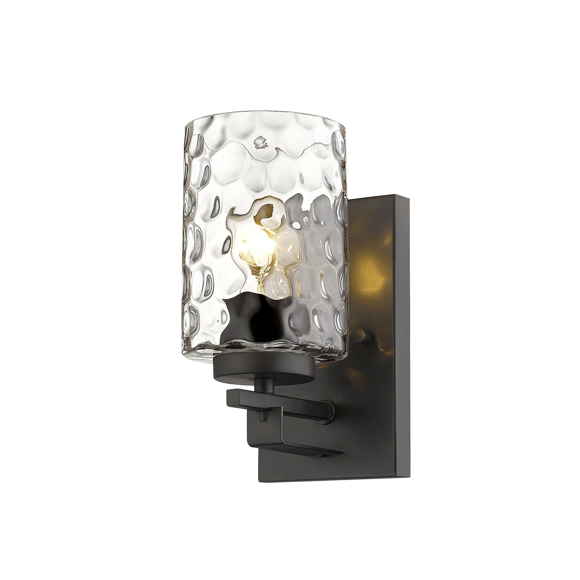 Right side angle view of the lighted  Bronze metal wall sconce with pebbled glass shade – modern indoor single-light fixture.