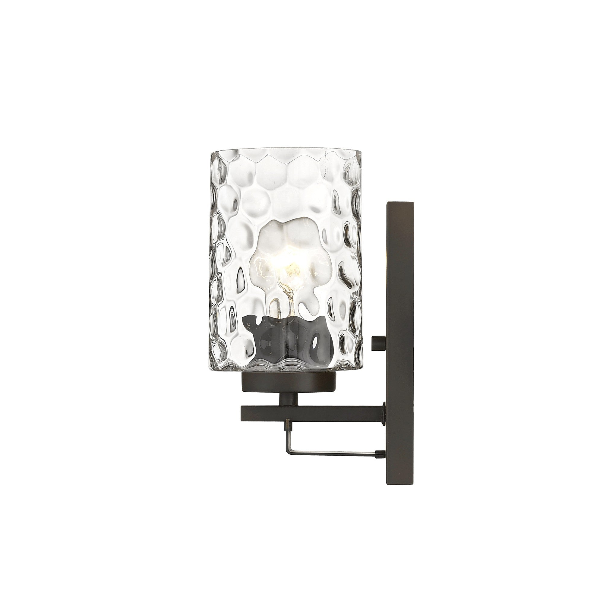 Side view of the lighted Bronze metal wall sconce with pebbled glass shade – modern indoor single-light fixture.