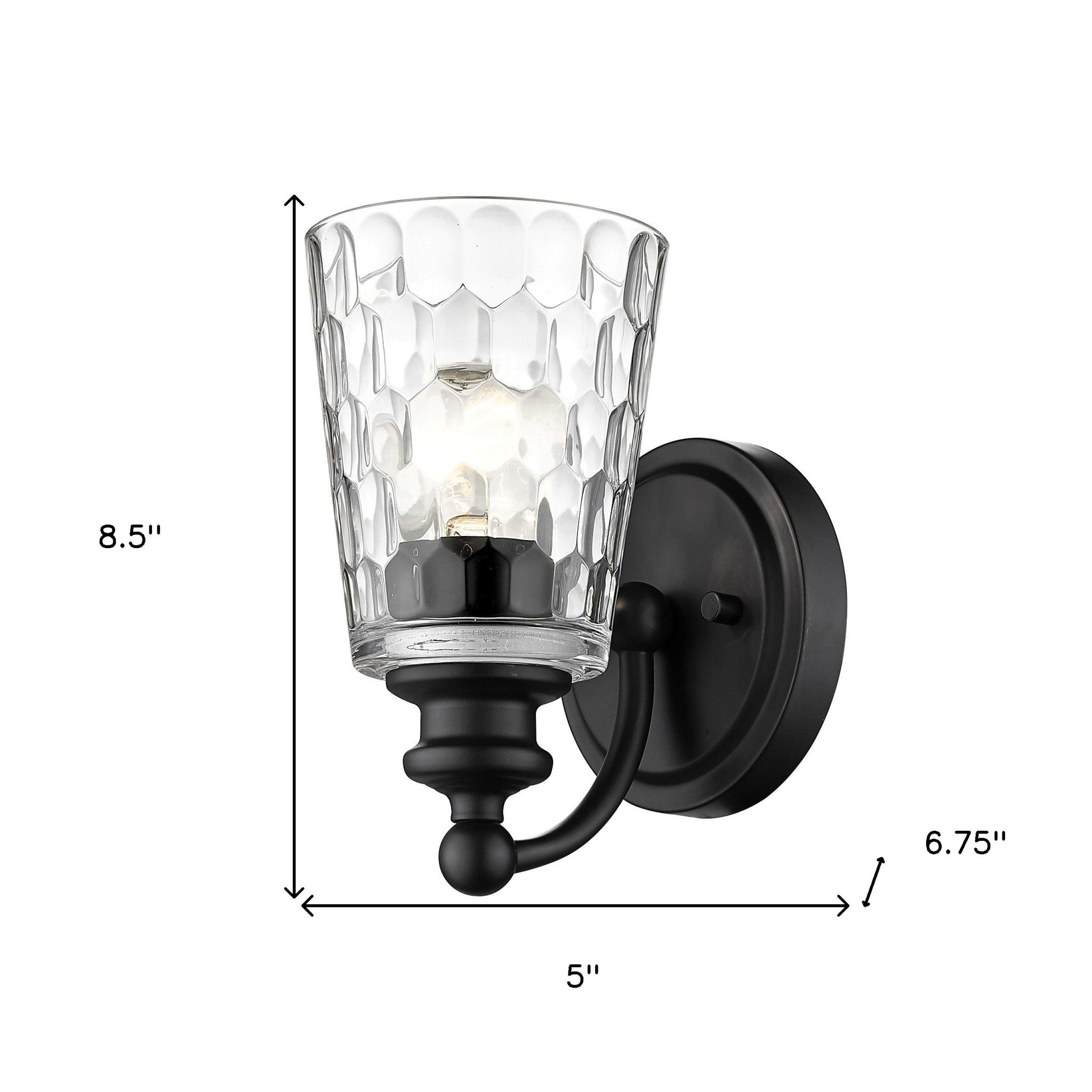Black metal wall sconce with pebbled glass shade – modern, dimmable indoor lighting fixture shown with dimensions of 8 point 5 inches high by 5 inches wide by 6 point 75 inches deep