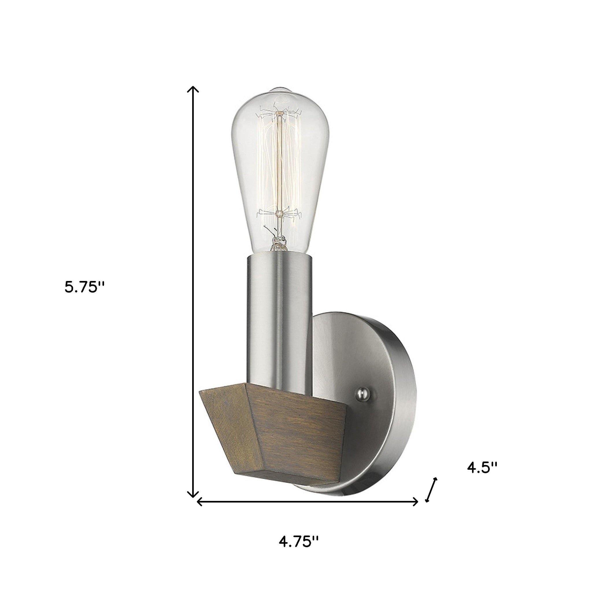 Silver metal wall sconce with dark wood accent – modern rustic indoor lighting fixture for home décor shown with dimensions of 5 point 75 inches high by 4 point 75 inches wide by 4 point 5 inches deep