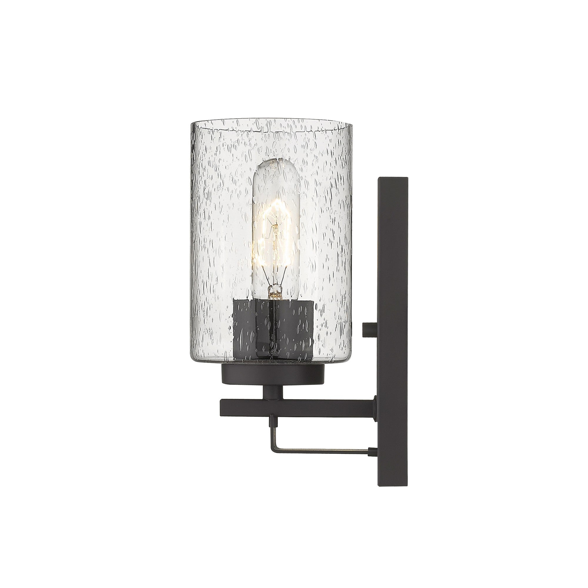Side view of the lighted Bronze metal wall sconce with clear seeded glass shade – modern indoor wall lighting fixture.