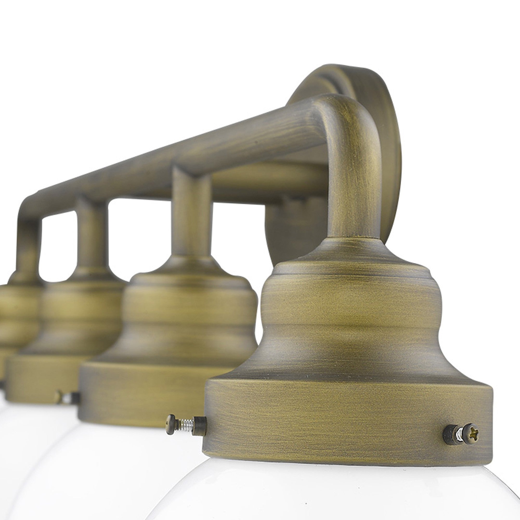 Zoomed in view of the wall plate, arms and bases of the Portsmith 4-light raw brass vanity with opal glass globes for retro-modern bathroom lighting, 36 inches wide and dimmable