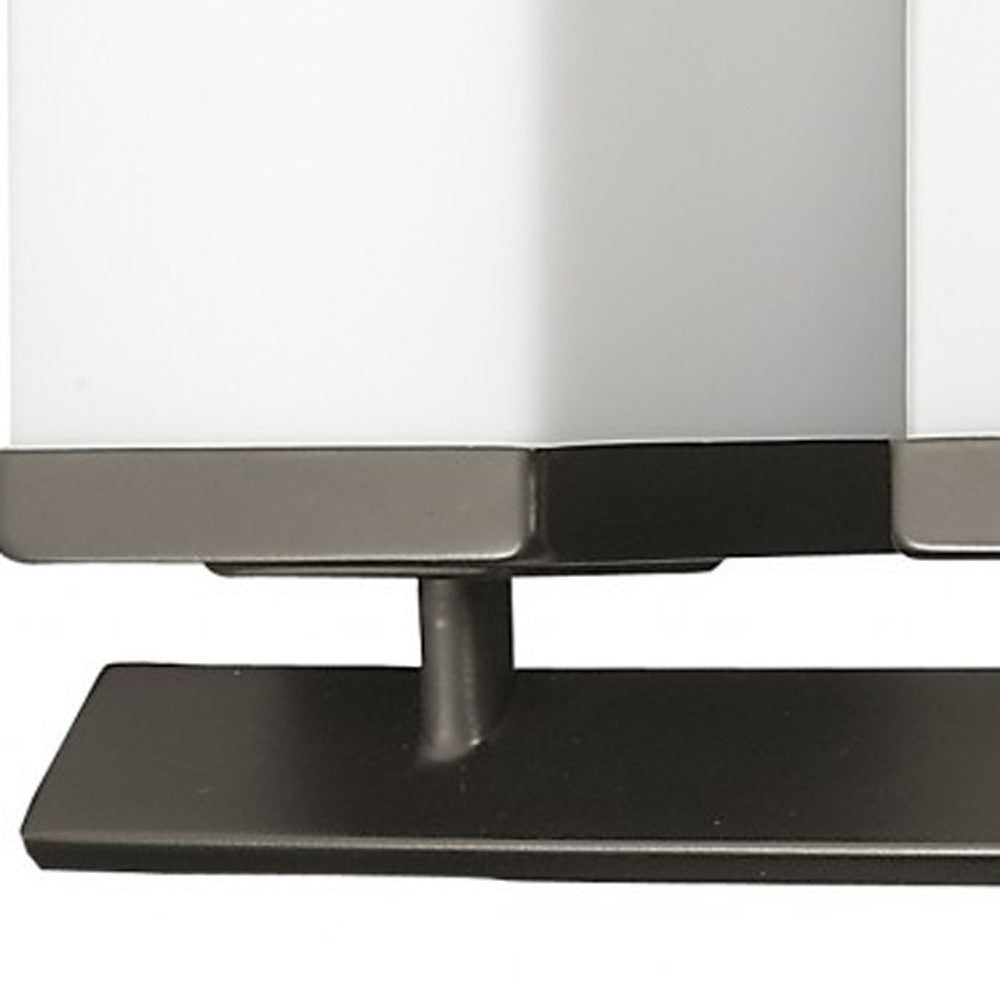 Zoomed in view of the bar, arm and partial shade of the Burgundy 5-light oil-rubbed bronze bathroom vanity light with square etched glass shades and angled bar