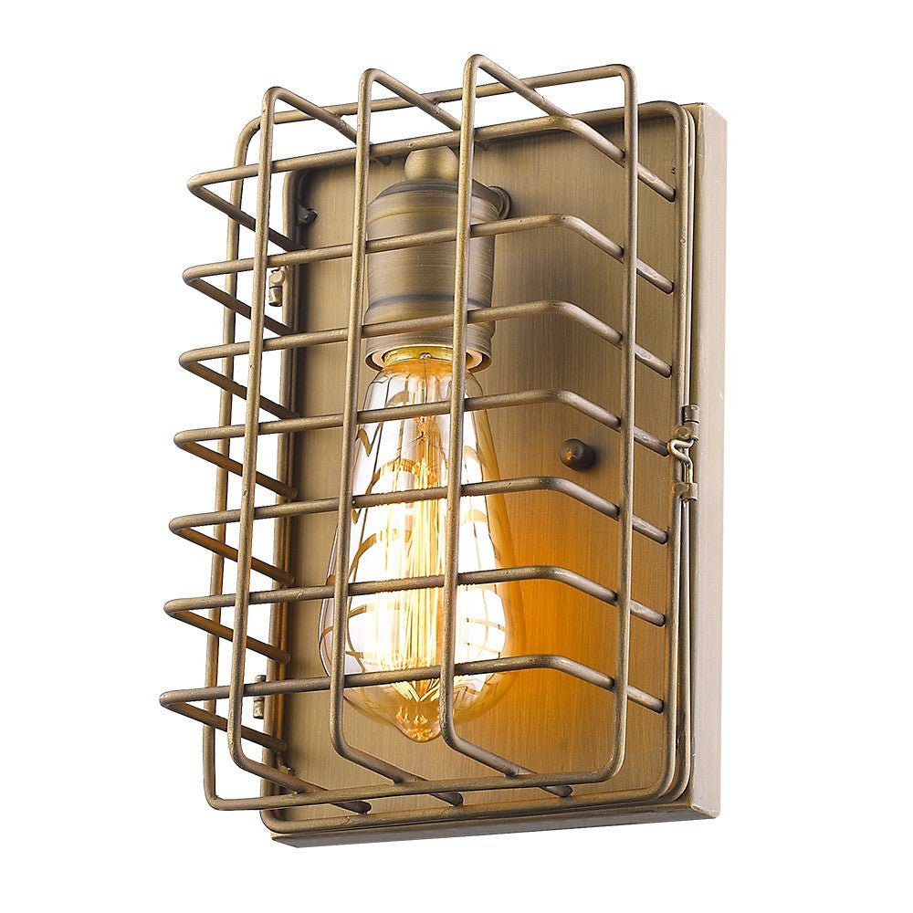 Front angled view of the lighted Industrial gold wall sconce with vintage-style bulb and open metal cage design