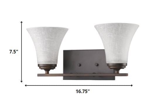 Two-light bronze wall fixture with tapered textured white glass shades and rectangular backplate shown with dimensions of seven point five inches high by sixteen point seven five inches wide
