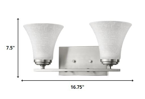 Two-light silver wall fixture with tapered textured glass shades and modern rectangular backplate shown with dimensions of seven point five inches high by sixteen point seven five inches wide