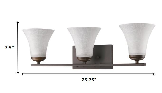 Three-Light Bronze Wall Fixture with Tapered Textured Glass Shades and classic design shown with dimensions of seven point five inches high by twenty five point seven five inches wide