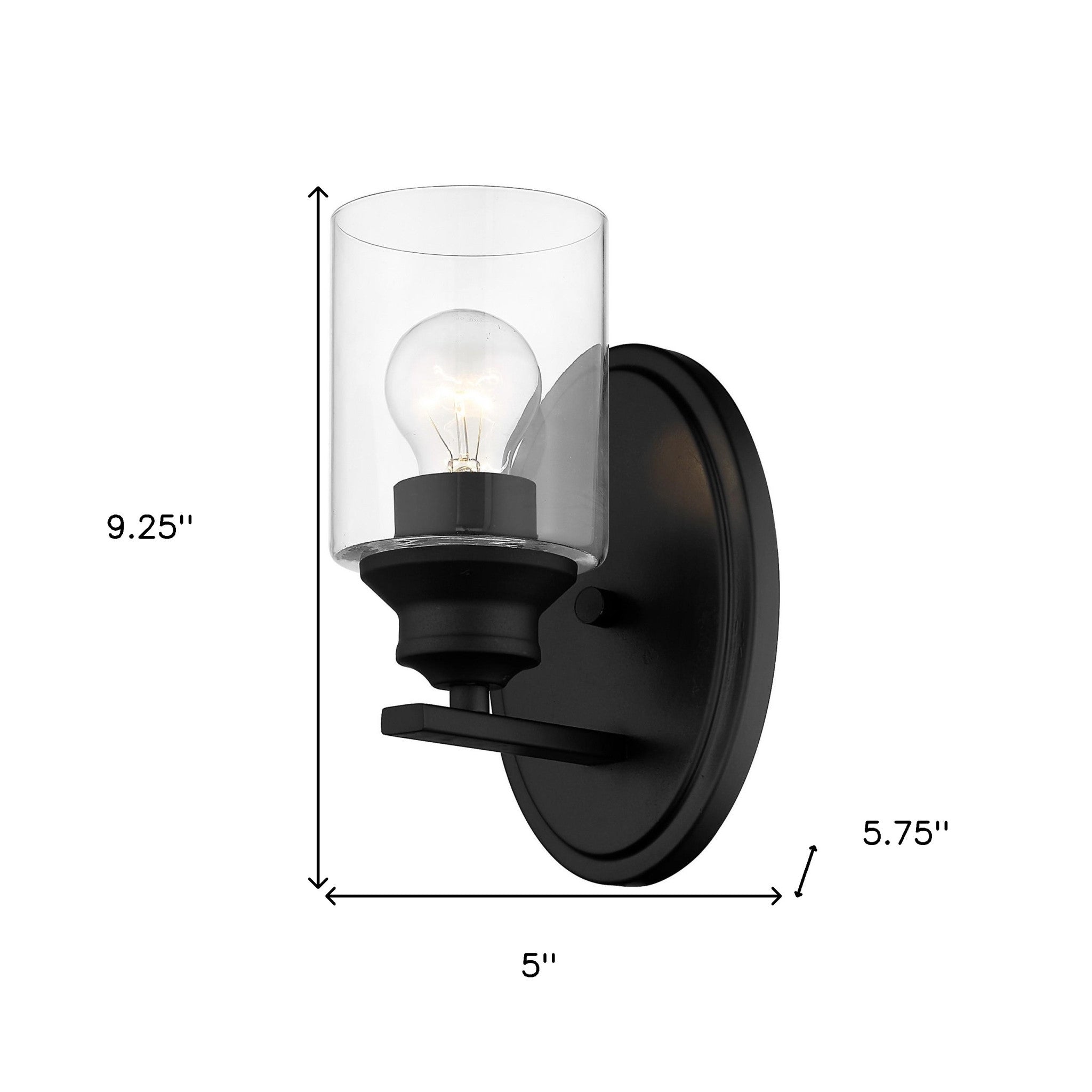 One-light matte black wall sconce with cylindrical clear glass shade and modern backplate shown with dimensions of nine point two five inches high by five inches wide by five point seven five inches deep