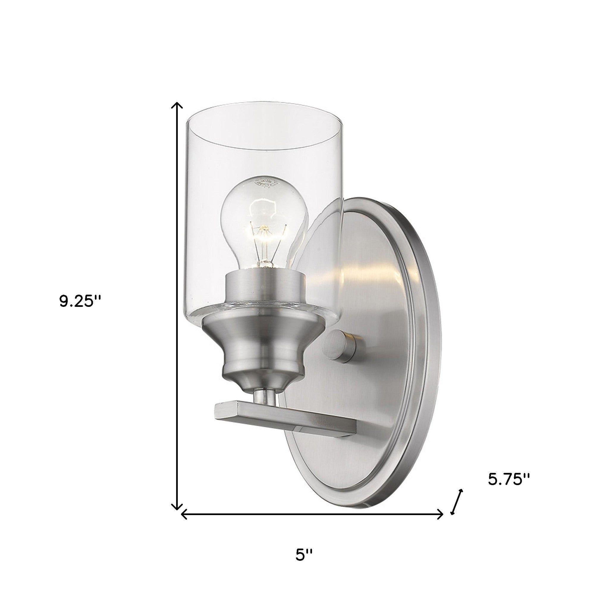 Modern silver wall sconce with oval backplate and clear glass shade for minimalist home lighting shown with dimensions of nine point two five inches high by five inches wide by five point seven five inches deep