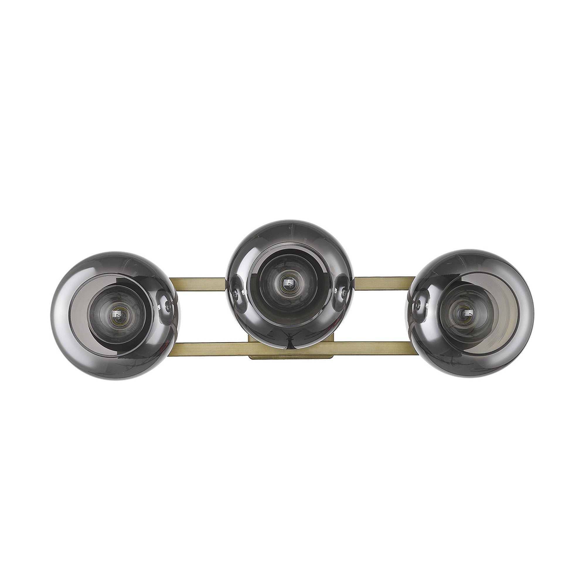 An straight on view of an Aged brass sconce with three smoked handblown glass shades, emitting a warm light, from the Lunette collection.