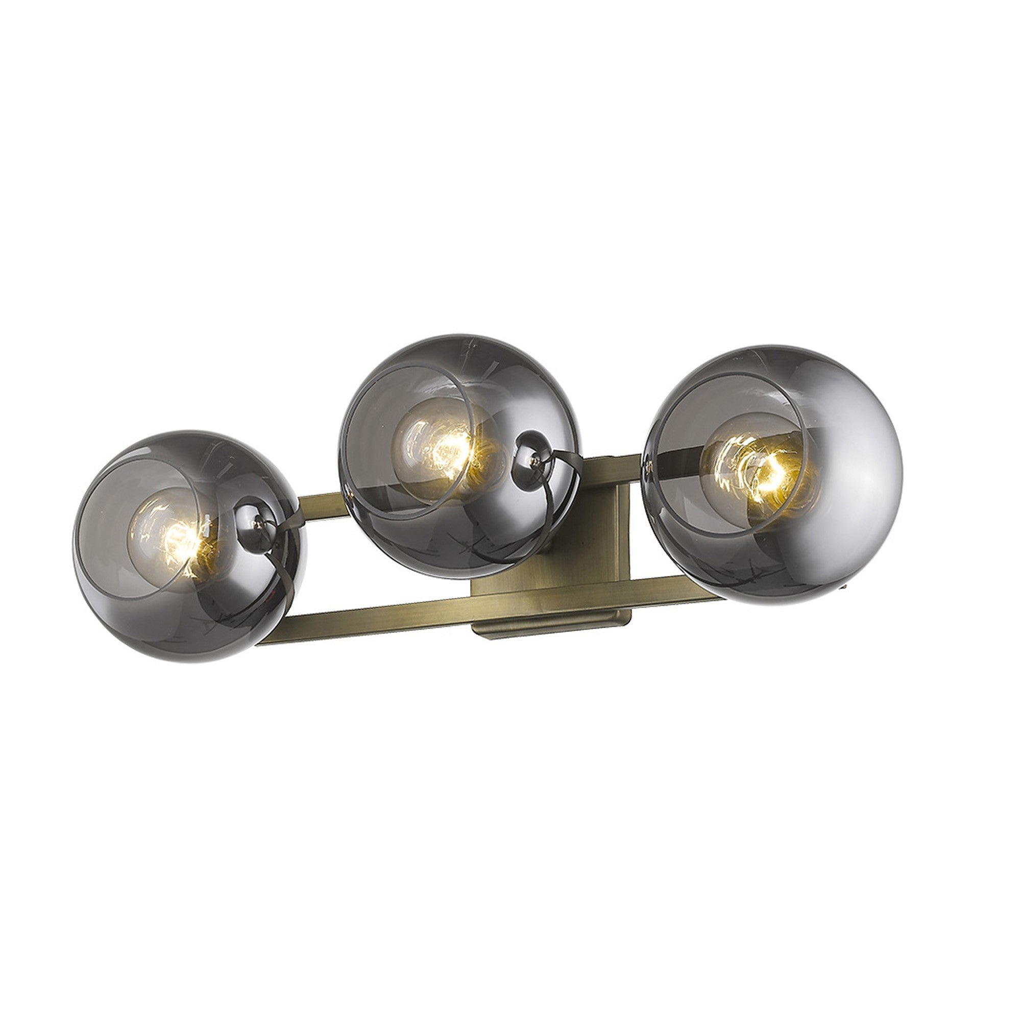 An bottom up view of a lighted Aged brass sconce with three smoked handblown glass shades, emitting a warm light, from the Lunette collection.