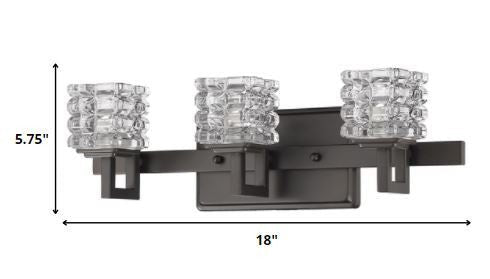 Three-light bronze wall vanity fixture with stacked clear crystal cube shades shown with dimensions