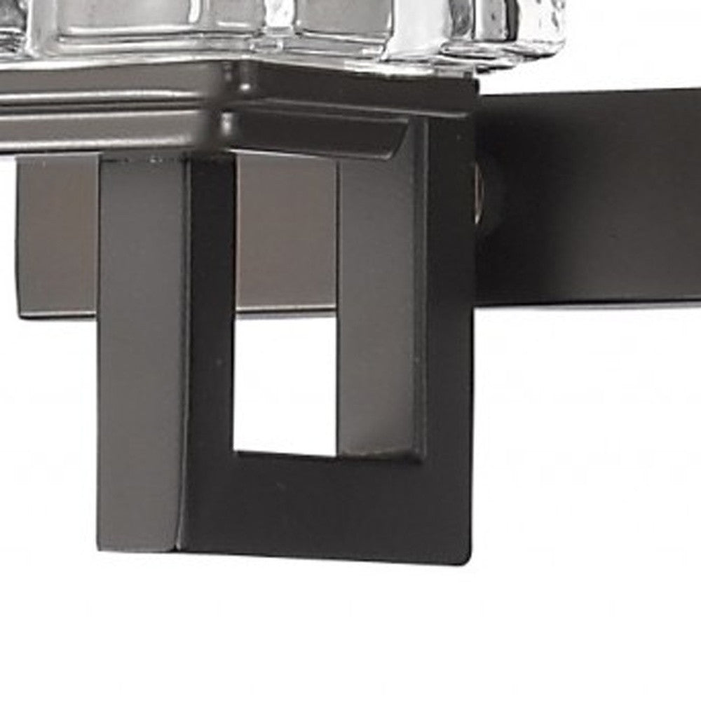 Close up view of one of the arms on the Coralie Three-light bronze wall vanity fixture with stacked clear crystal cube shades