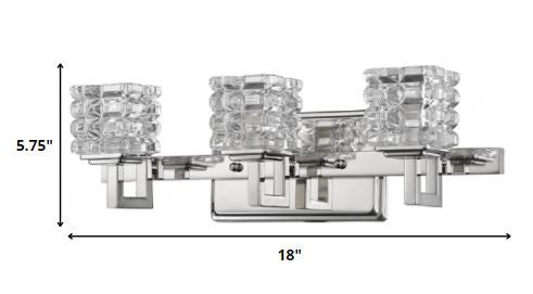 Three-light chrome vanity wall fixture with geometric crystal glass shades shown with dimensions
