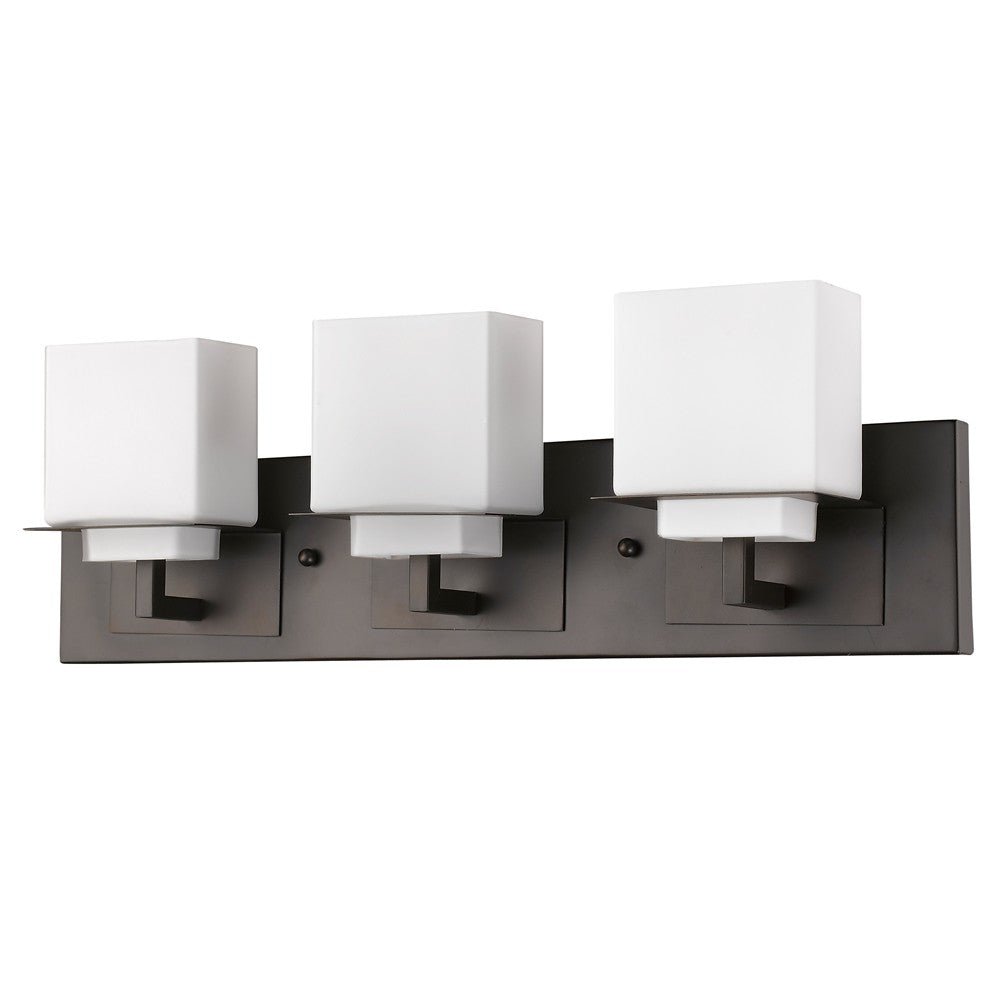 Angled view of the Rampart Oil-rubbed bronze three-light vanity fixture with modern square frosted glass shades