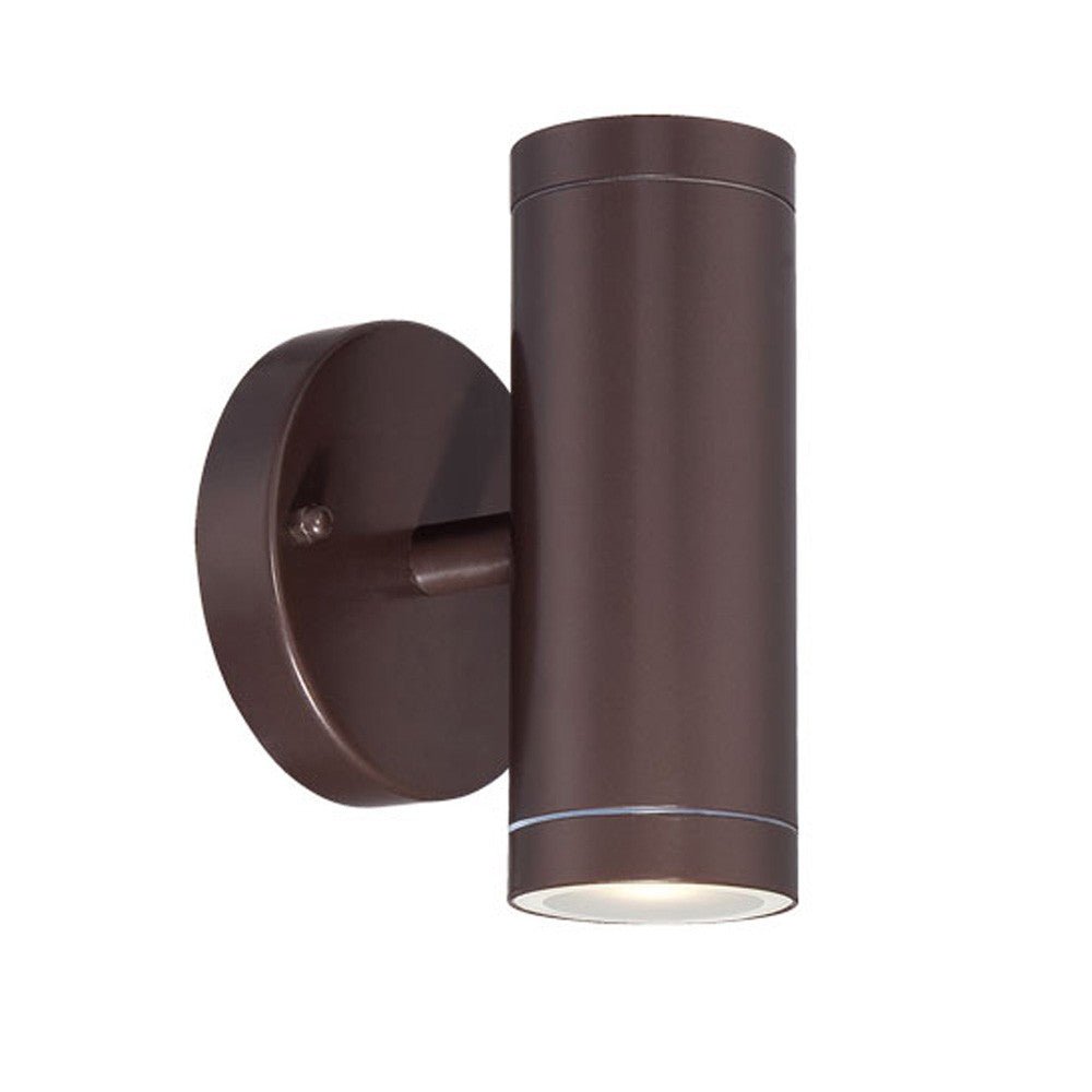 Side angled view of a lighted Bronze outdoor up and down cylindrical wall sconce with round backplate