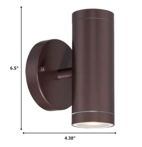Bronze outdoor up and down cylindrical wall sconce with round backplate shown with dimensions