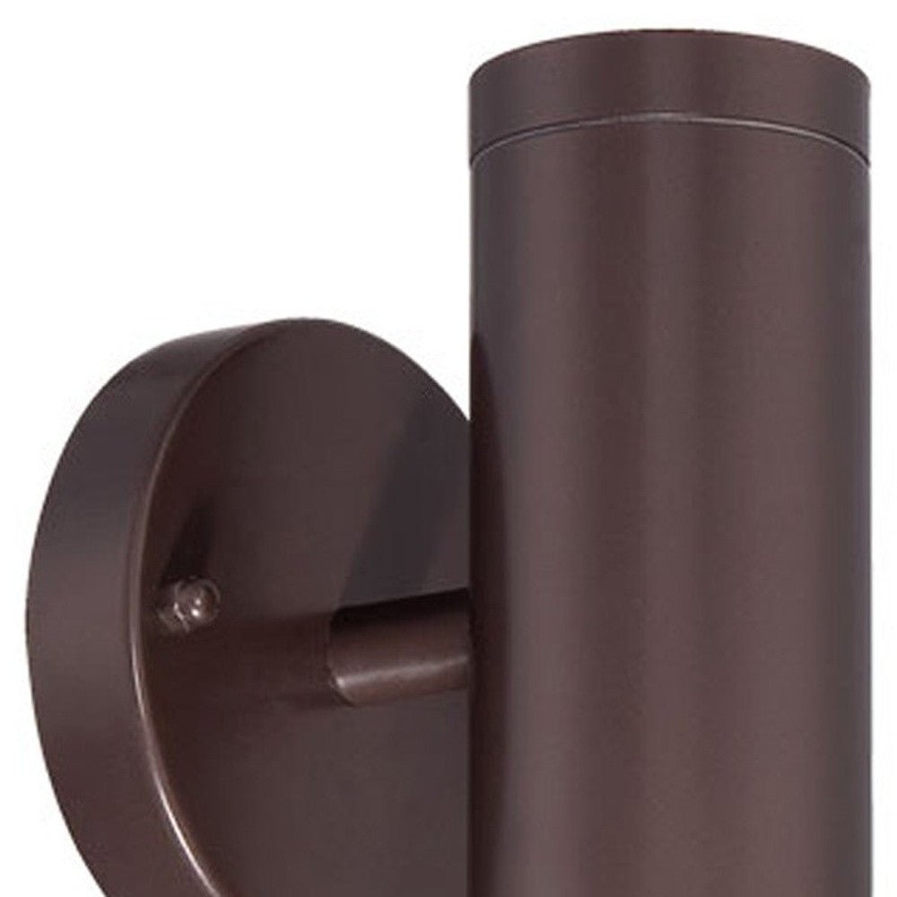 Close-up view of the wall plate and cylinder of Bronze outdoor up and down cylindrical wall sconce with round backplate