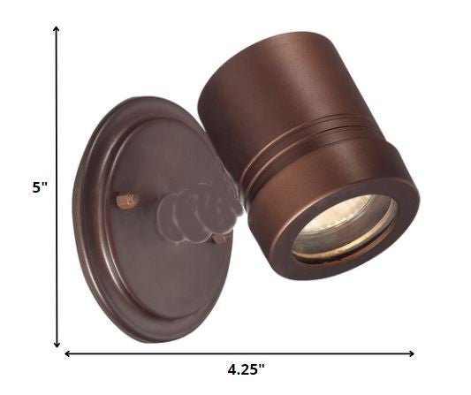 Adjustable bronze outdoor wall spotlight with round backplate and modern cylindrical head shown with dimensions