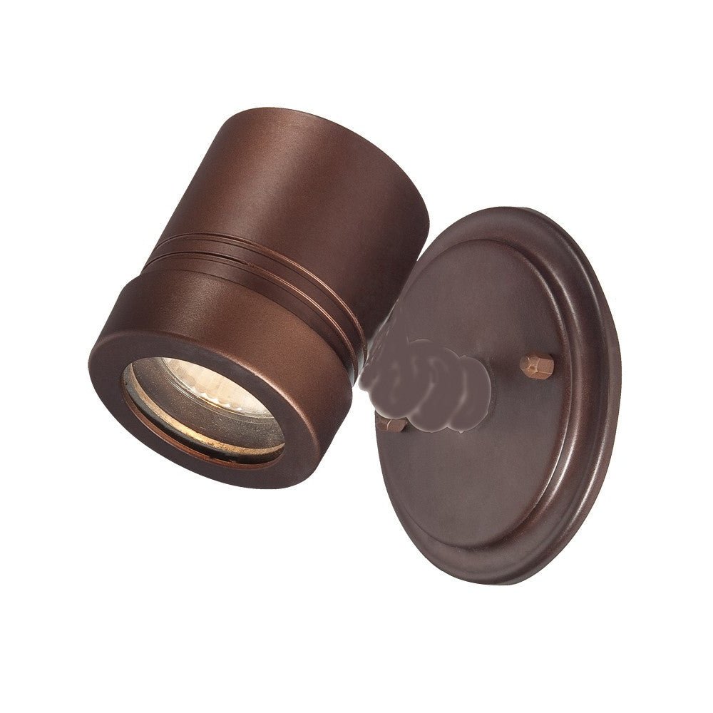 Angled side view of a lighted Adjustable bronze outdoor wall spotlight with round backplate and modern cylindrical head