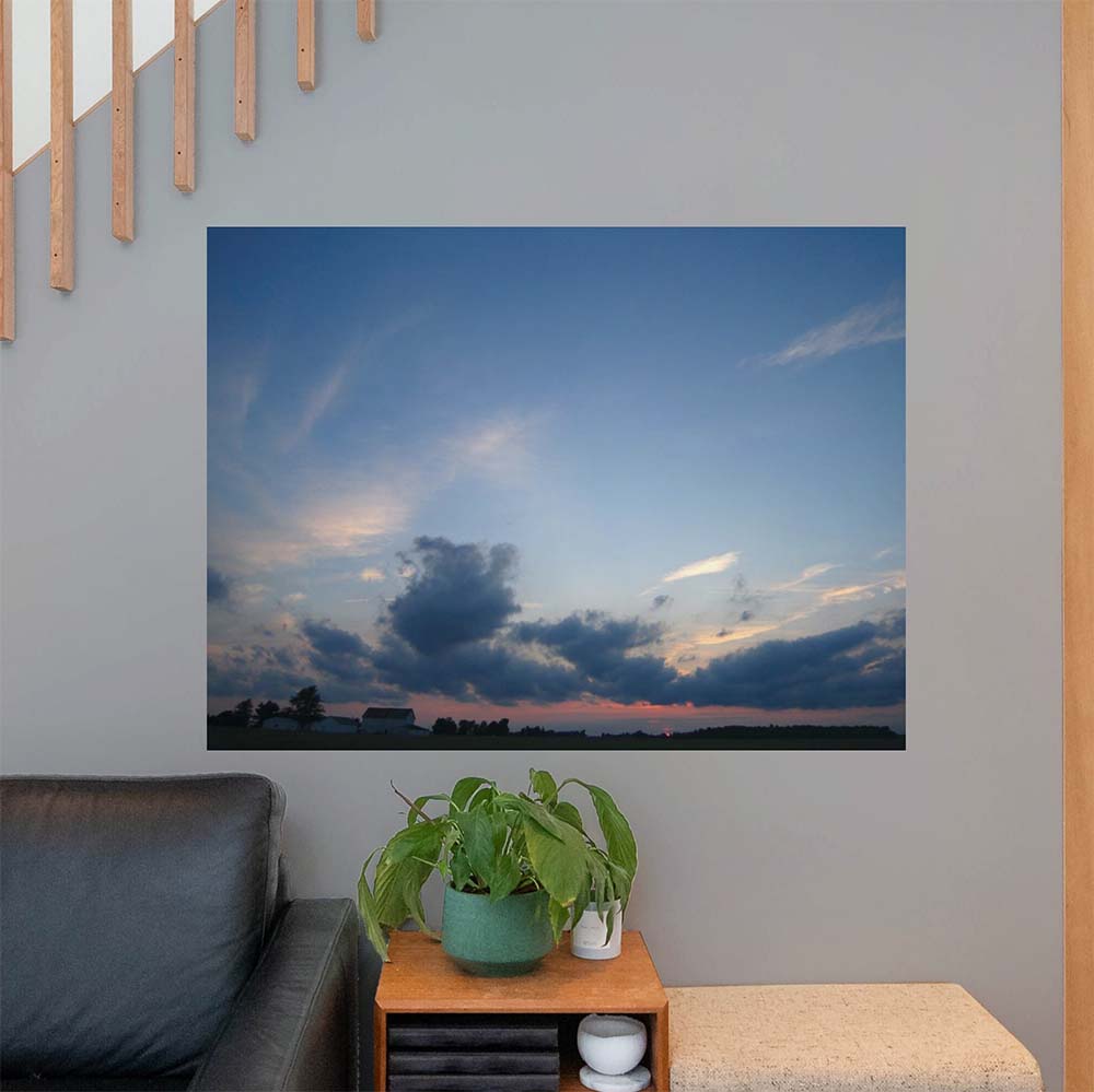 36x48 inch Clouds Poster Displayed Above End Table