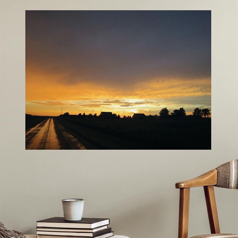 36x48 inch Sunset IV Poster Displayed Above Stacked Books