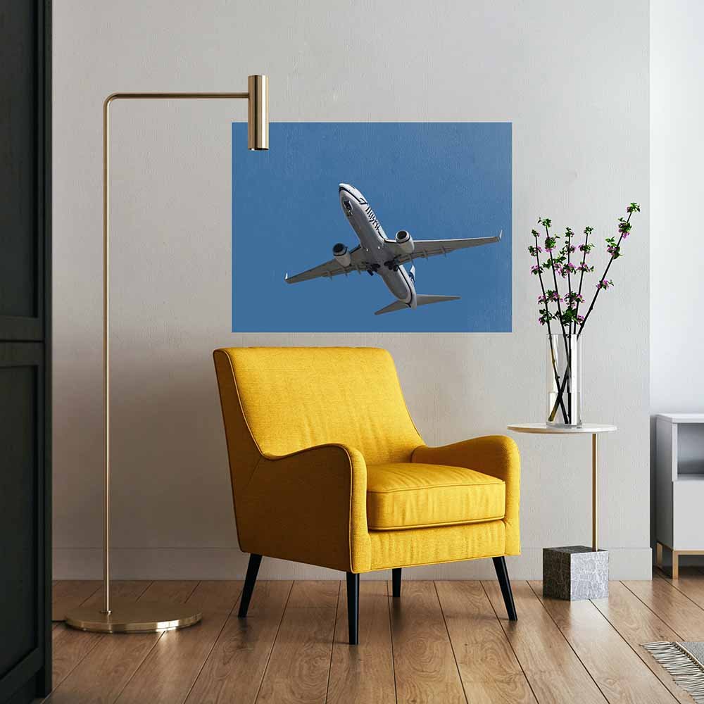36x48 Alaska Air 737 Flyover Poster Displayed Above Chair