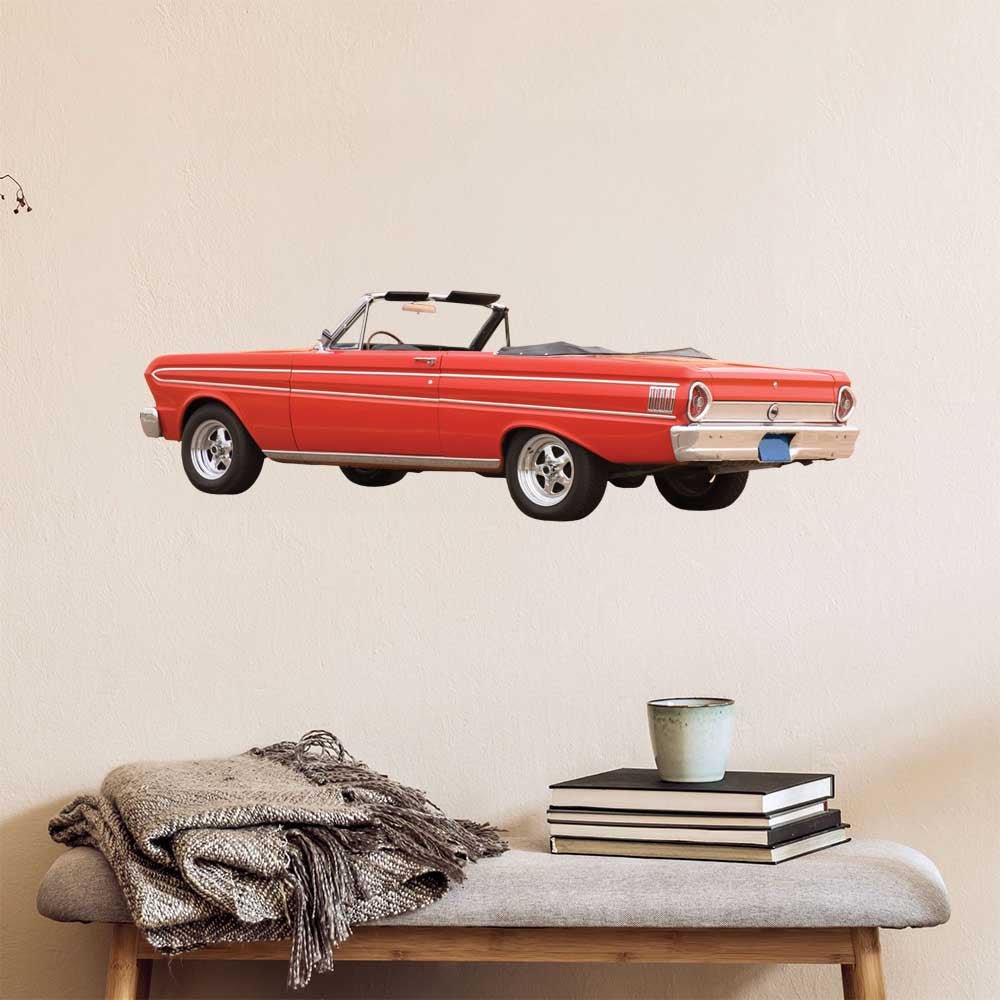 48 inch Red Ford Falcon convertible car decal installed on a wall above a bench with books and a plant.