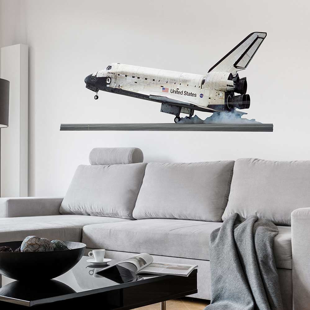 18x48 inch Shuttle Discovery Landing Decal Installed Above Sofa