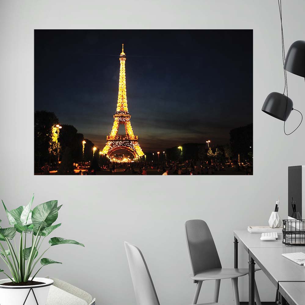 48 inch decal of the illuminated Eiffel Tower at nigh against a dark sky installed on a wall in an office area