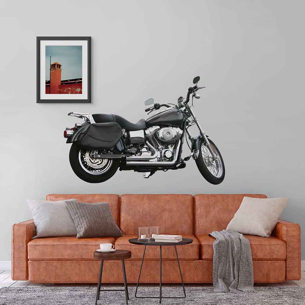 60 inch black and silver commuter motorcycle decal installed on wall above sofa