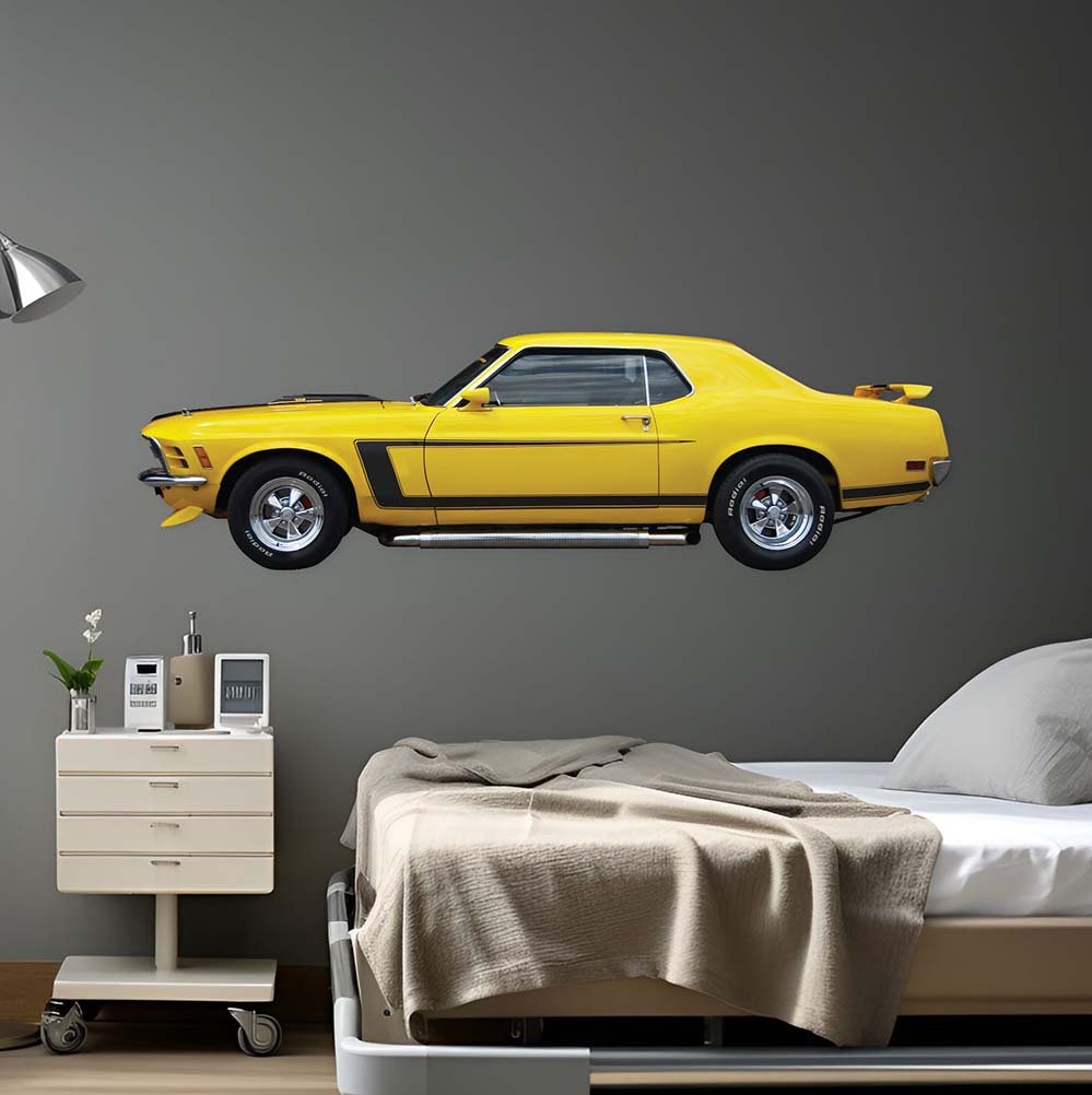 60 inch Yellow mustang muscle car decal installed on a gray wall above a bed and nightstand.