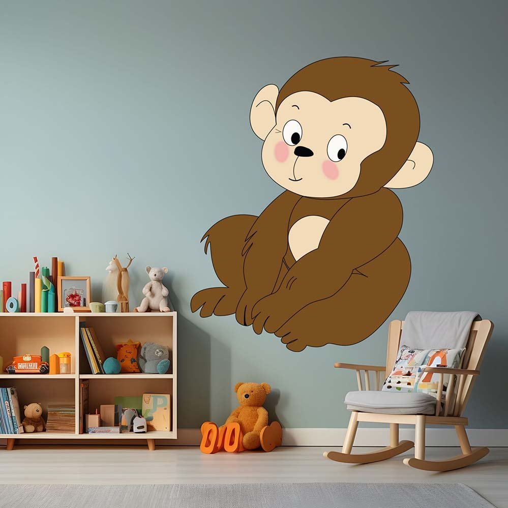 Children's room with the Baby Monkey cartoon wall decal installed on wall above rocking chair, and bookshelf.