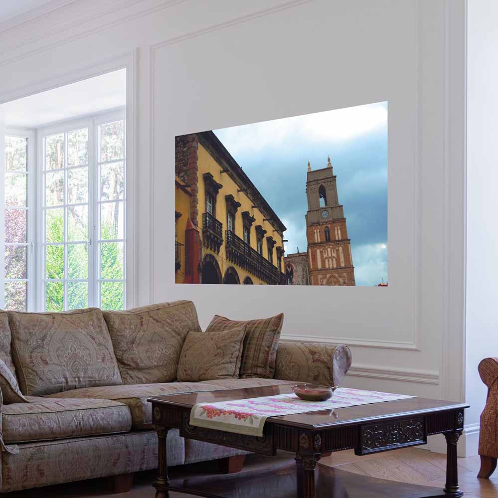 60 inch Mexican cathedral tower and building against a blue sky wall decal installed on wall in a living room