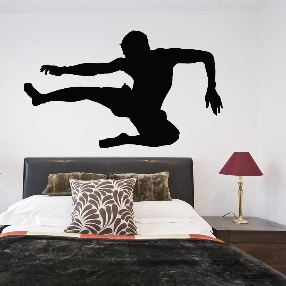 72 inch Martial Arts Flying Kick Silhouette Wall Decal Installed Above Bed