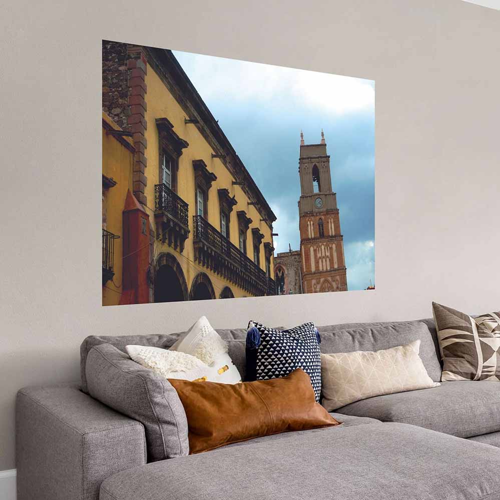 72 inch Mexican Cathedral Tower and hotel poster displayed on wall above a sofa