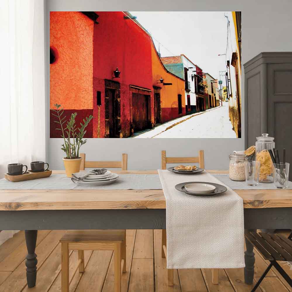 72 inch colorful Mexican street scene decal with colorful buildings installed on a wall in a dining area