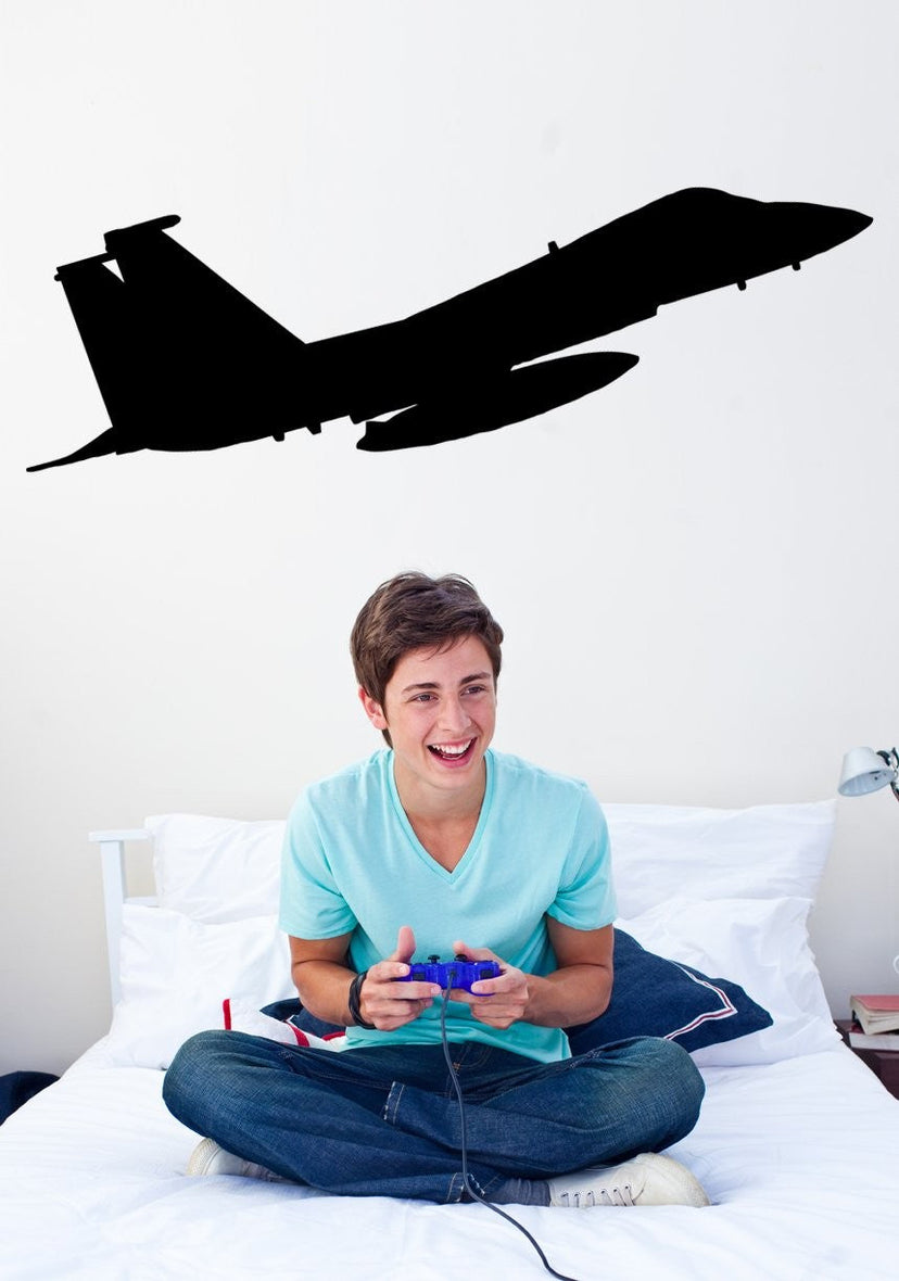 F-15E Strike Eagle military jet silhouette wall decal displayed above a bedroom wall