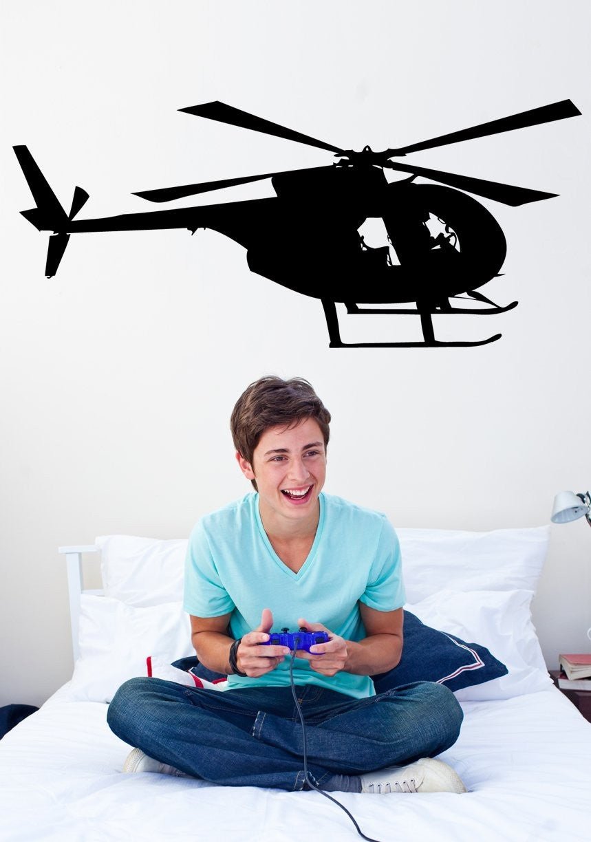 Hughes OH-6 Cayuse military helicopter silhouette wall decal by Jaycee Haynes installed in teens bedroom