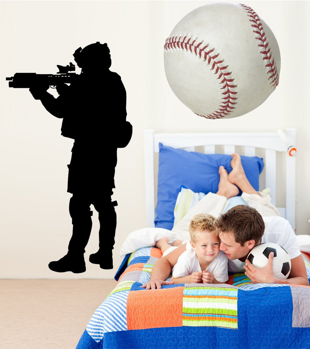 Military combat soldier aiming rifle tactical silhouette wall decal by Jaycee Haynes installed in kids bedroom
