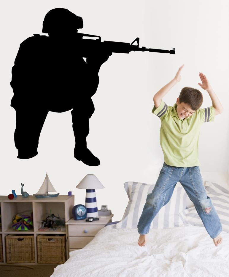 Military kneeling combat soldier aiming rifle silhouette wall decal by Jaycee Haynes installed in boys room