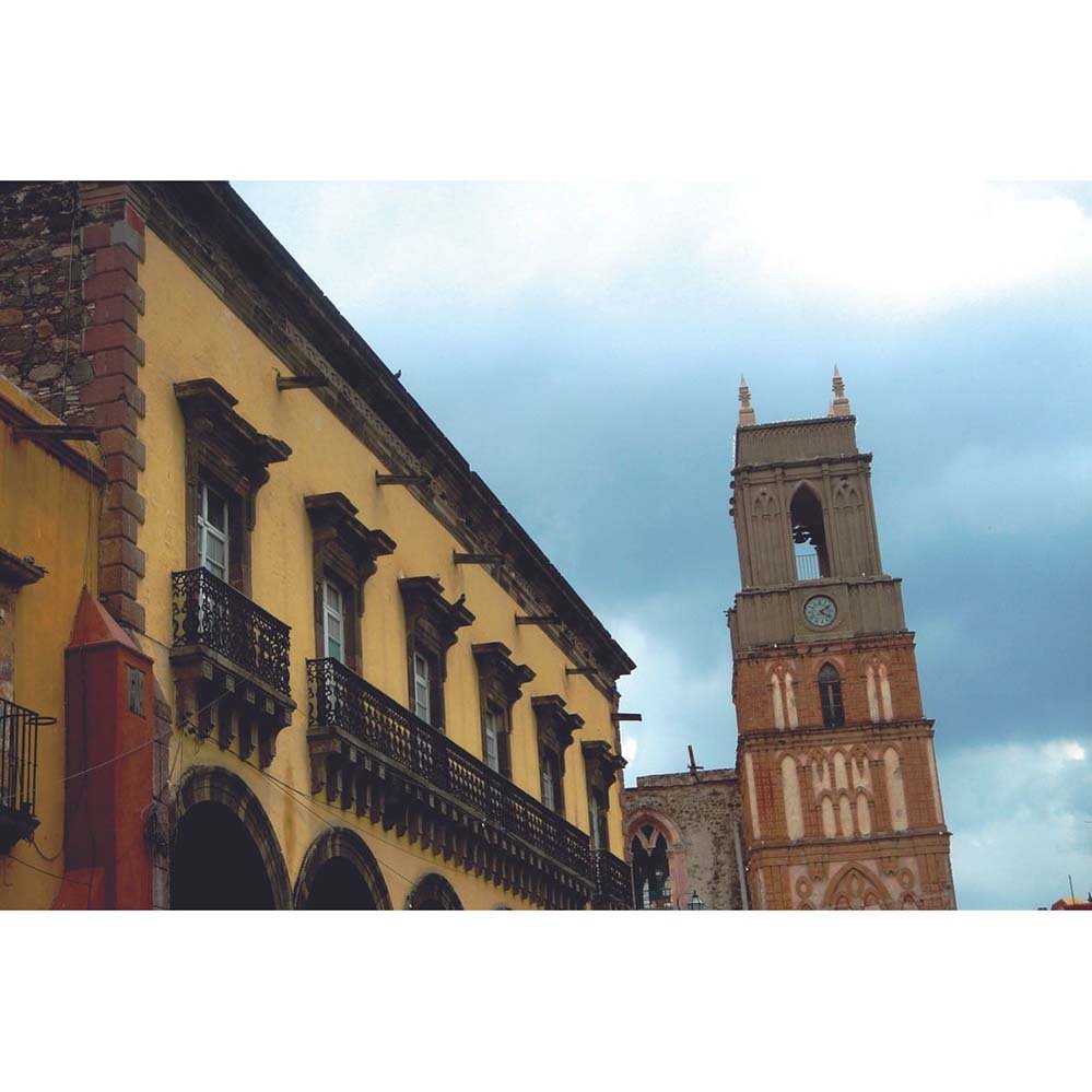Mexican cathedral tower against a blue sky wall decal printed | Wallhogs